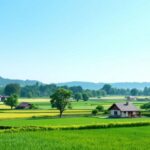 Pemandangan desa dengan rumah tradisional dan ladang hijau.